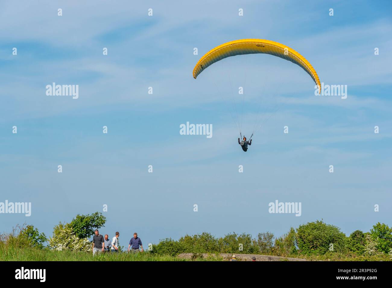 Normandy, France. A paraglider over the fields of Longues-sur-mer, a site of a german coastal gun battery from WWII Stock Photo
