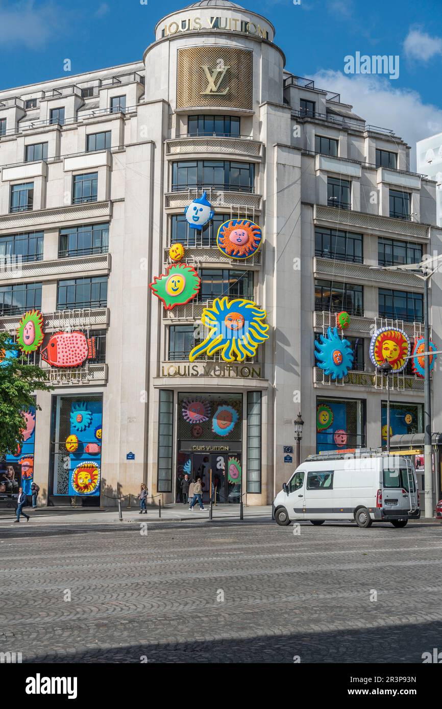 Champs-Élysées, Paris. The decorated bulding of Louis Vuitton fashion company, with colorful flowers and symbols on it Stock Photo