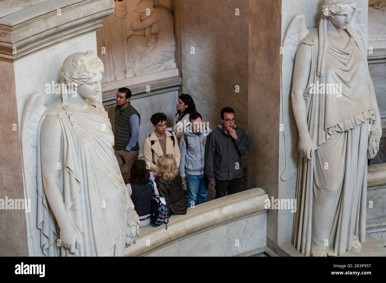 Paris, France. People look at Napoleon's tomb at Les invalides. Angels made of marble o either side. Stock Photo