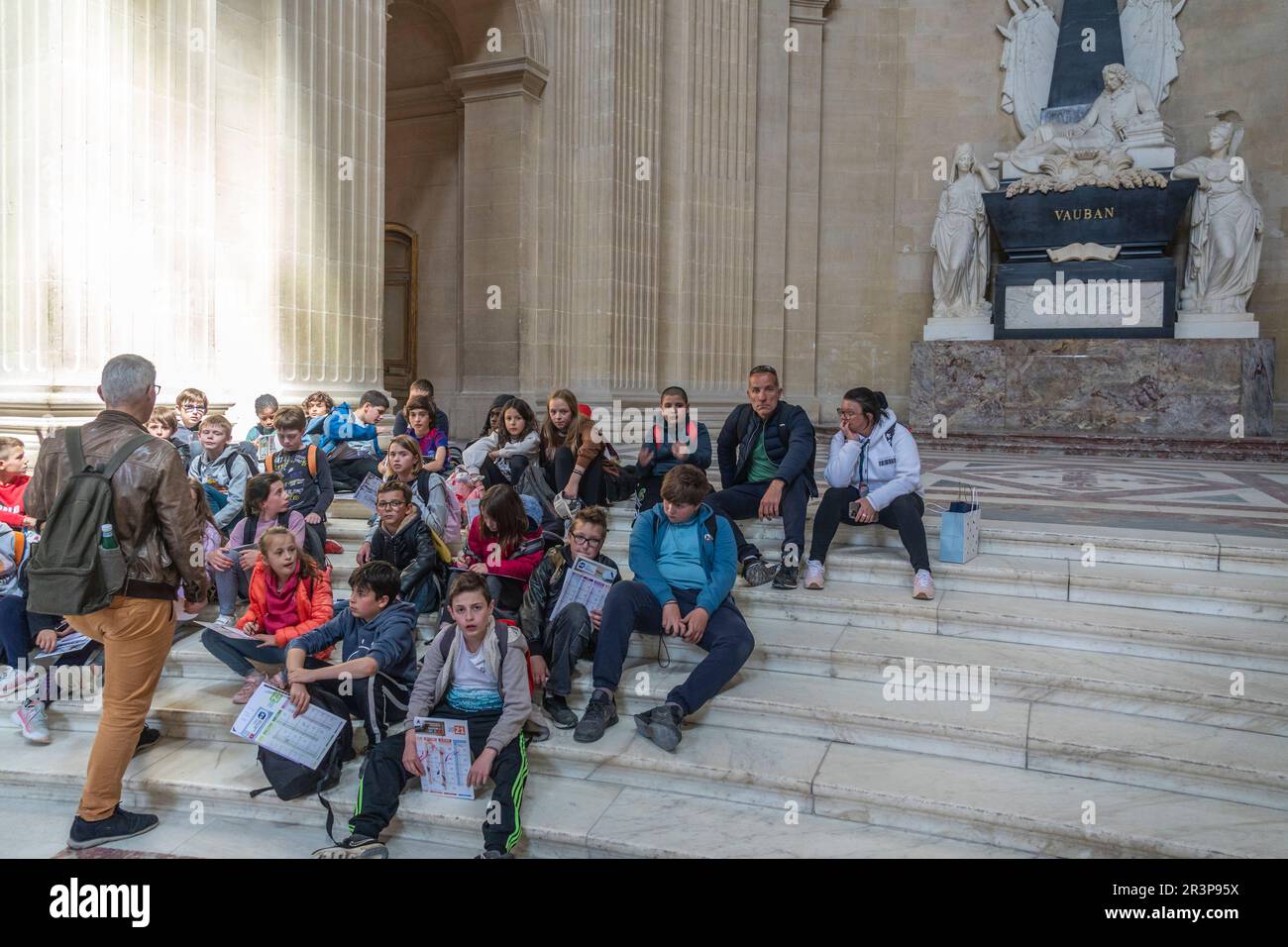 Paris, France. schoolchildren listed to their teacher as they visit Napoleon's tomb at Les invalides. Stock Photo