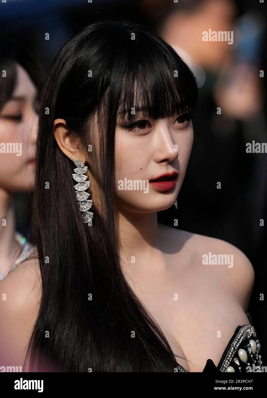 Giselle, from the group aespa, pose for photographers upon arrival at