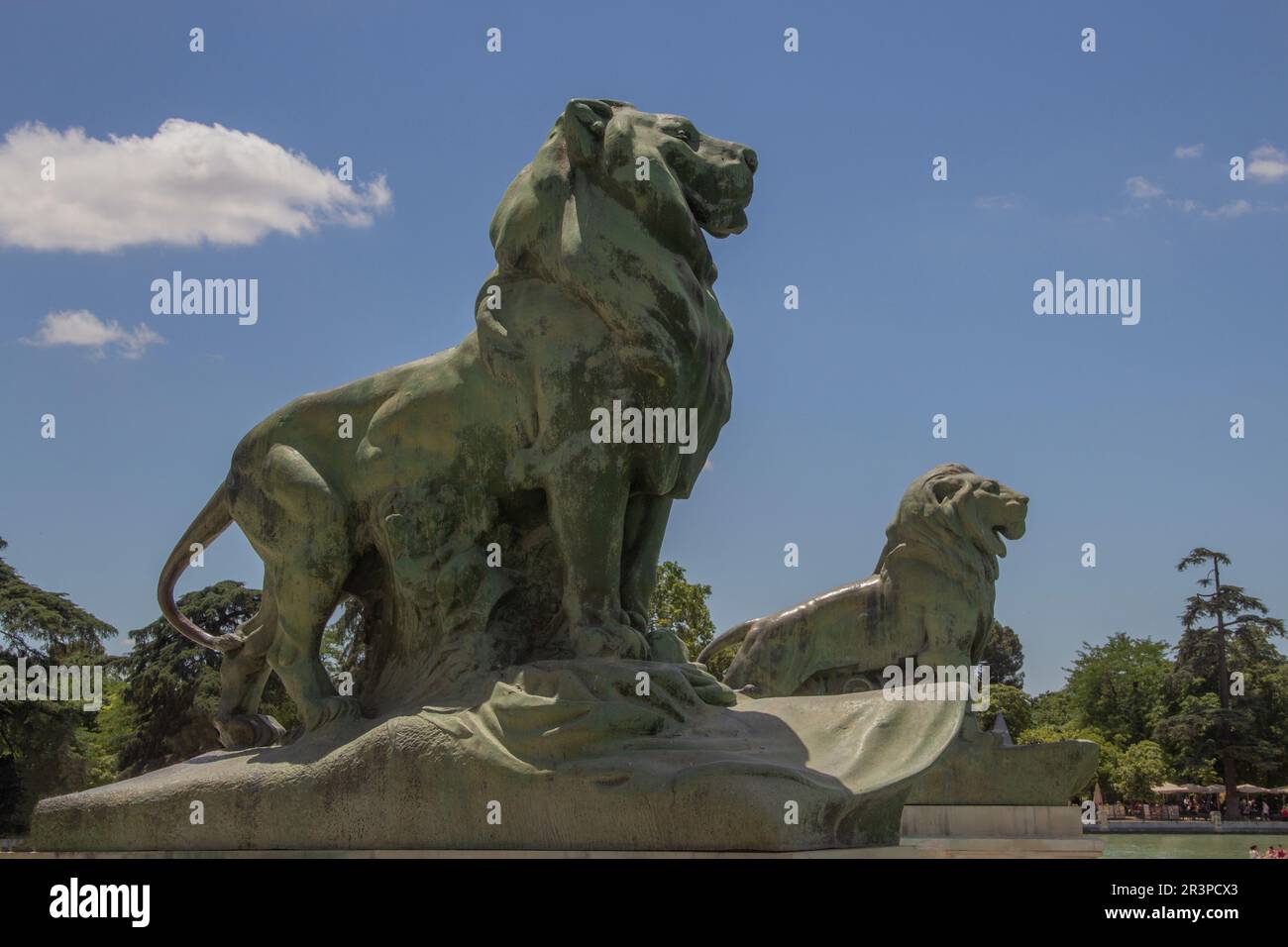 Lions in the Retiro park in Madrid, Spain Monumento a Alfonso XII, Leones en el parque El Retiro de Madrid, España. Stock Photo