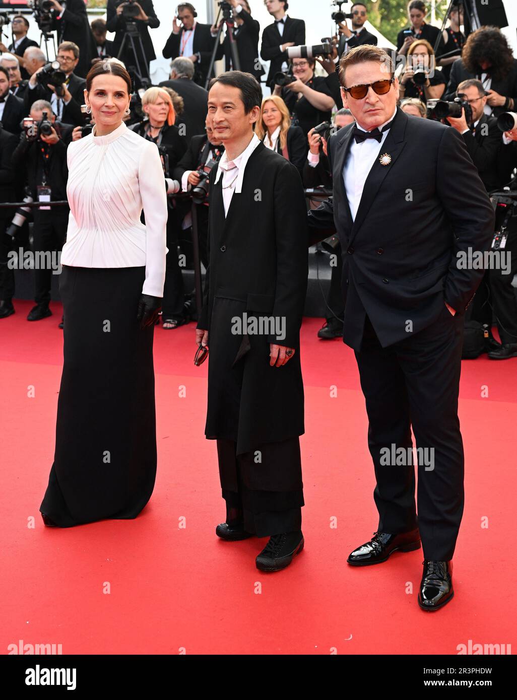 Cannes, France. 24th May, 2023. Lao director Tran Anh Hung, French actress Juliette Binoche and actor Benoit Magimel attend the premiere of The Pot-Au-Feu at the 76th Cannes Film Festival at Palais des Festivals in Cannes, France on Wednesday, May 24, 2023. Photo by Rune Hellestad/ Credit: UPI/Alamy Live News Stock Photo