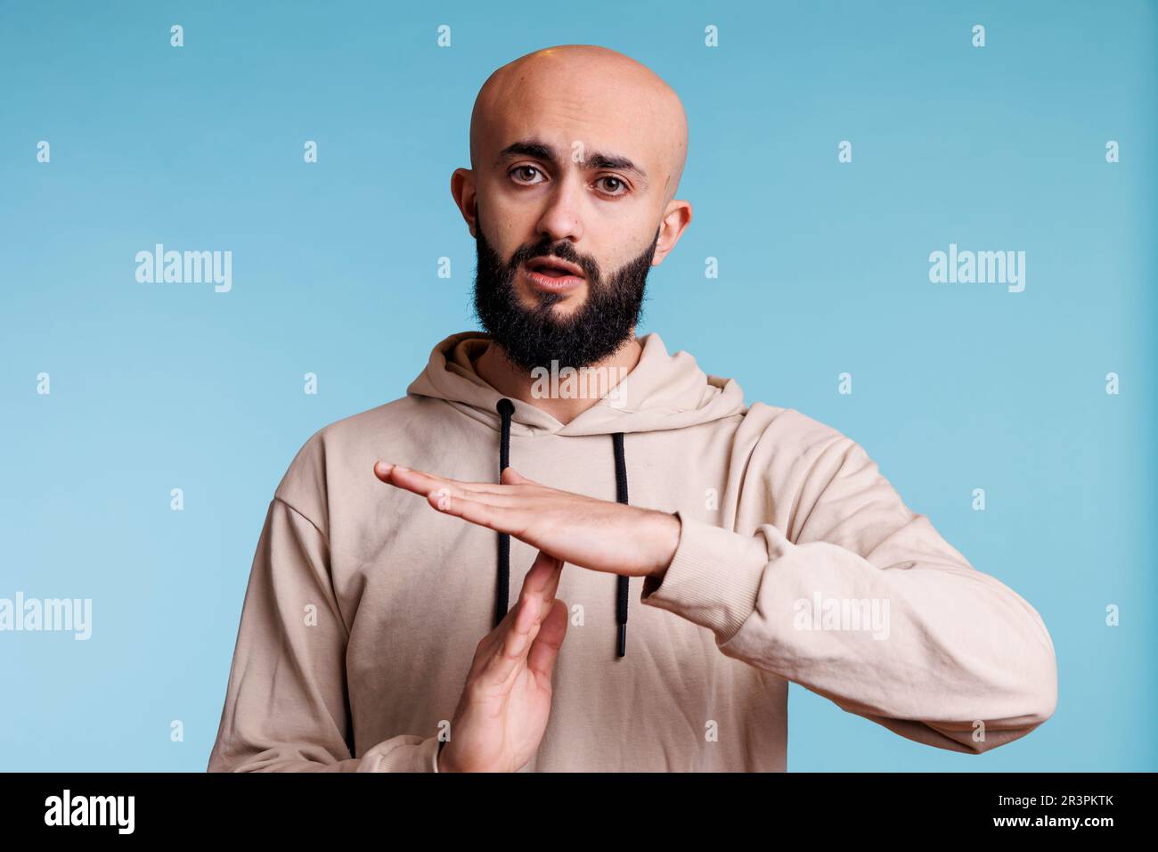 Arab man making time out gesture Stock Photo