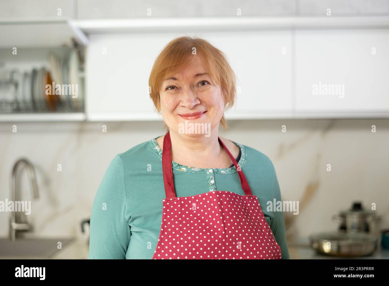 Happy older lady standing hi-res stock photography and images - Alamy