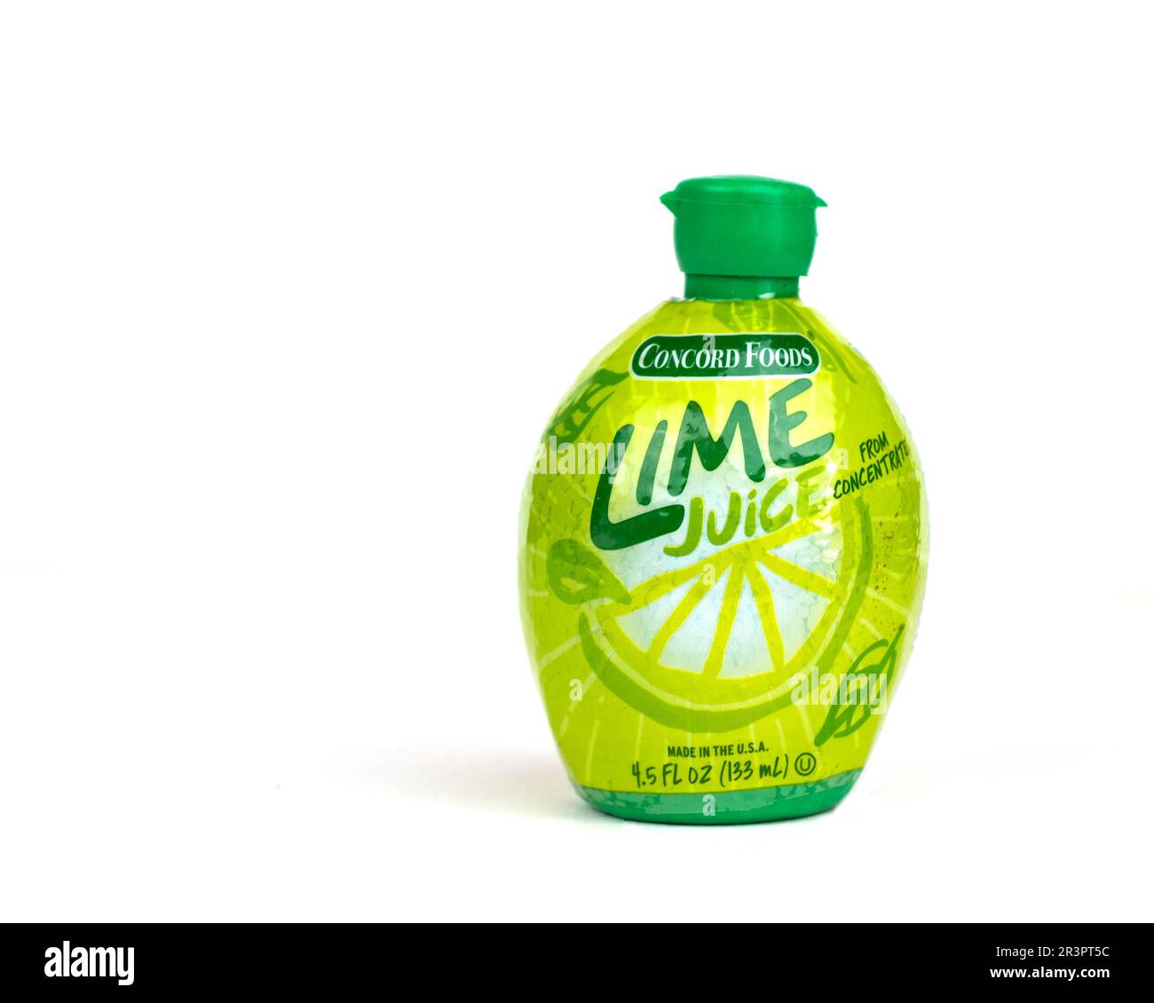 A plastic squeeze bottle with a flip-top lid of Concord Foods Lime Juice from concentrate on a white background, USA. Stock Photo
