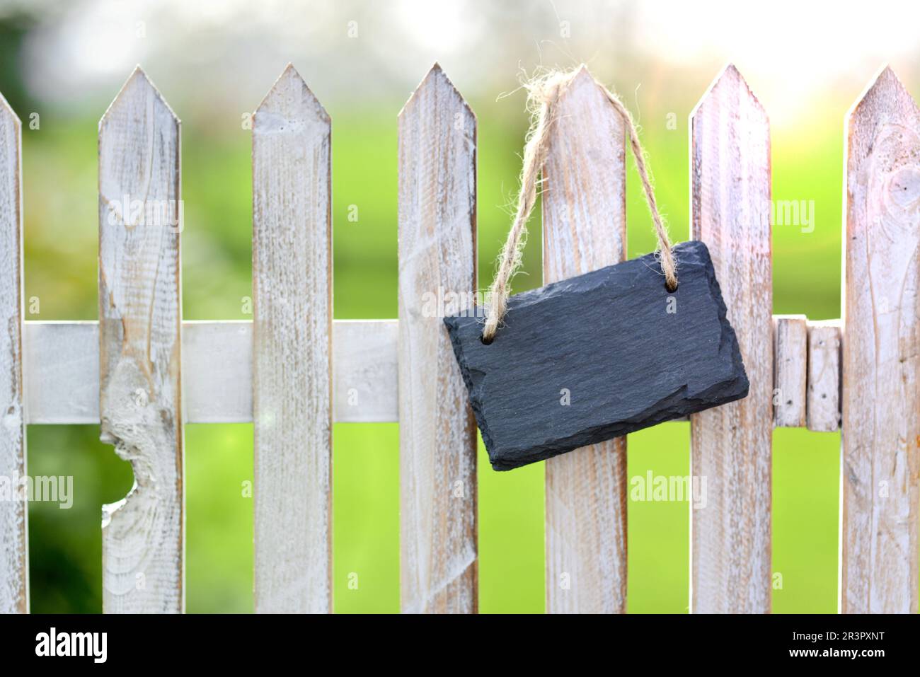 garden fence with empty black board Stock Photo