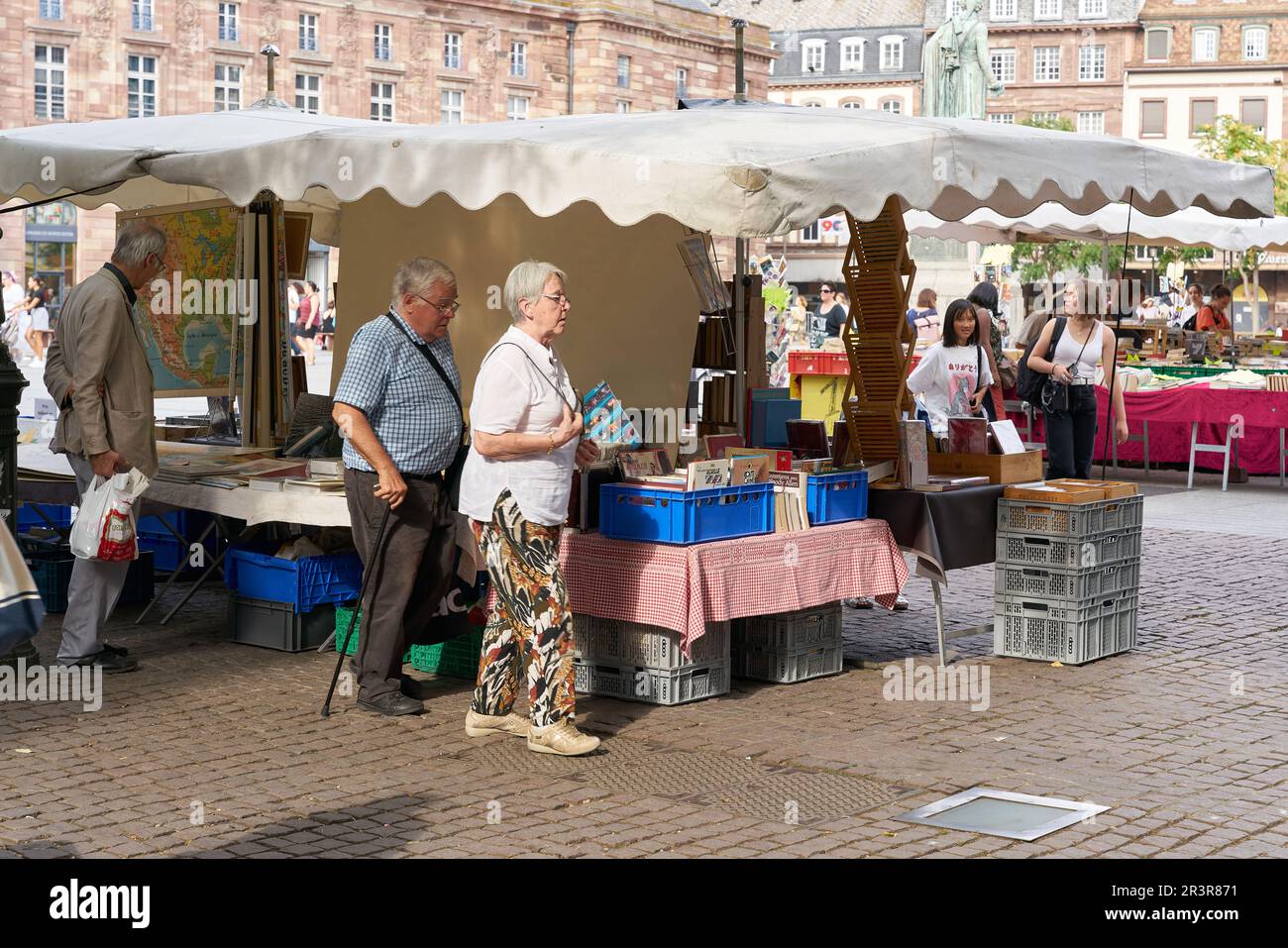 Flea market with visitors on a market place in the old town of Strasbourg in France Stock Photo