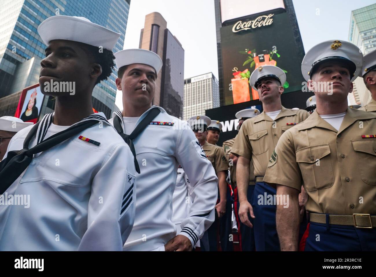 Military members of the United States Navy and Marines gather for a