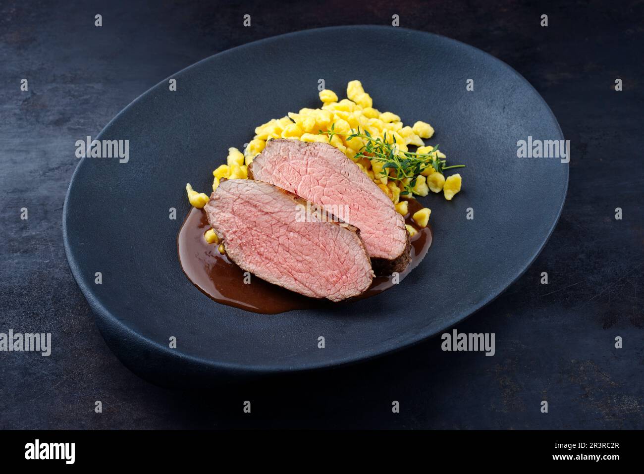 Tafelspitz roast veal slices with Swabian spaetzle served with dark ...