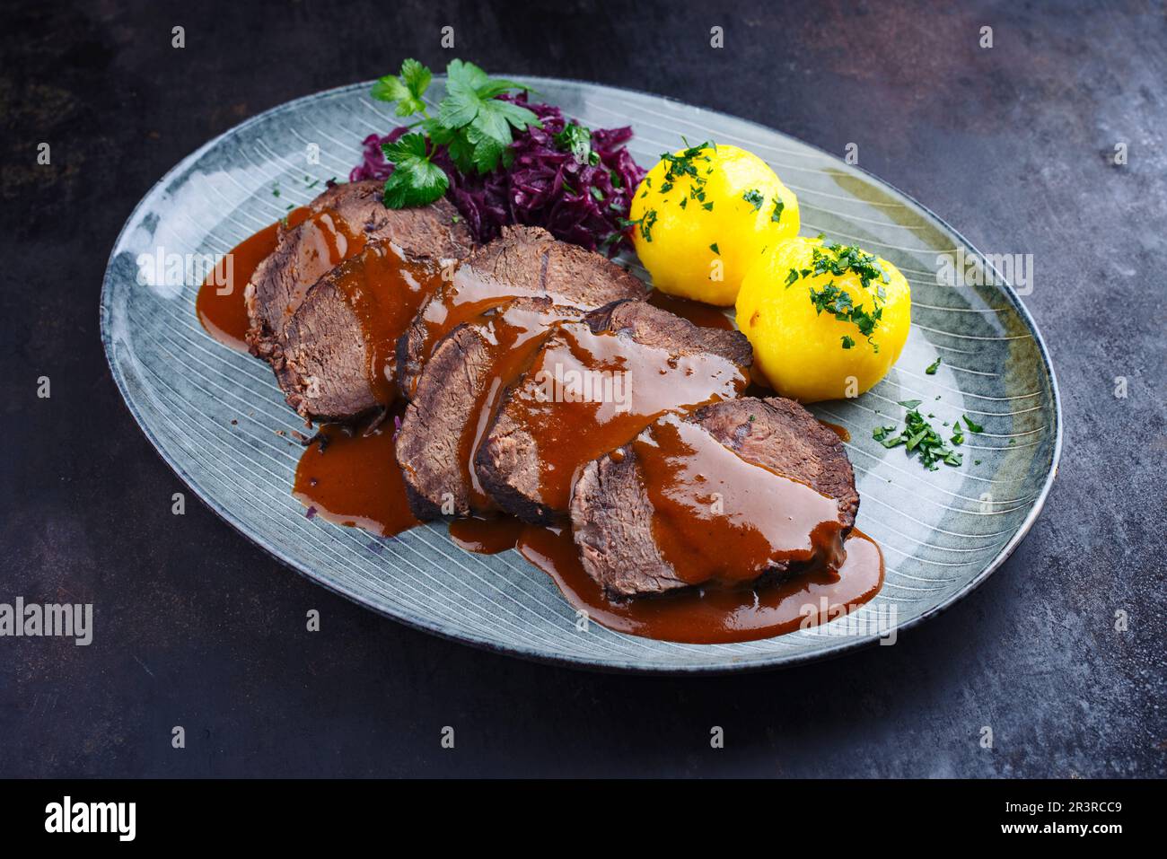 German Poutine Traditional braised marinated German Sauerbraten from beef with blue ...
