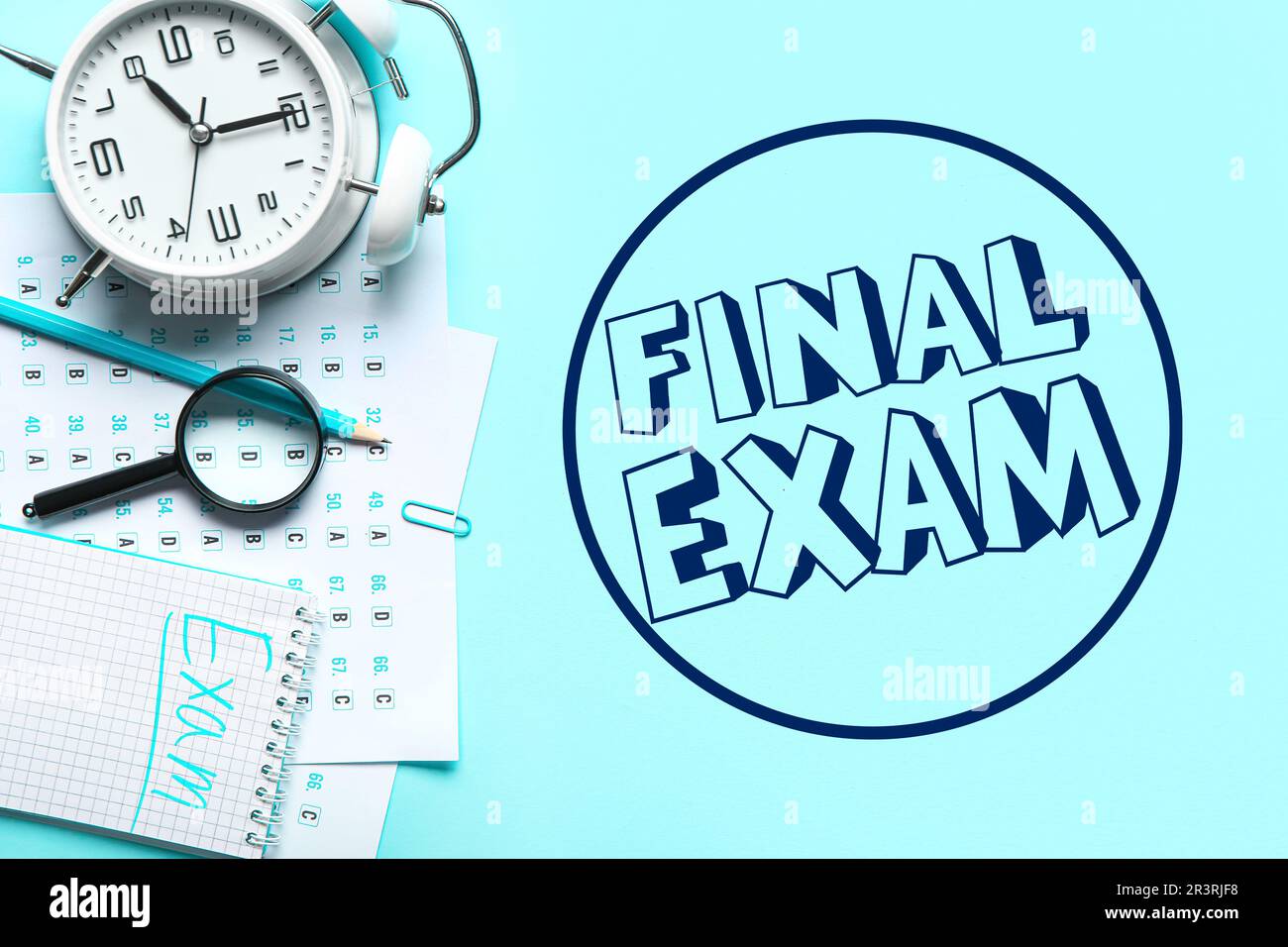 Answer sheets, magnifier, alarm clock and text FINAL EXAM on light blue