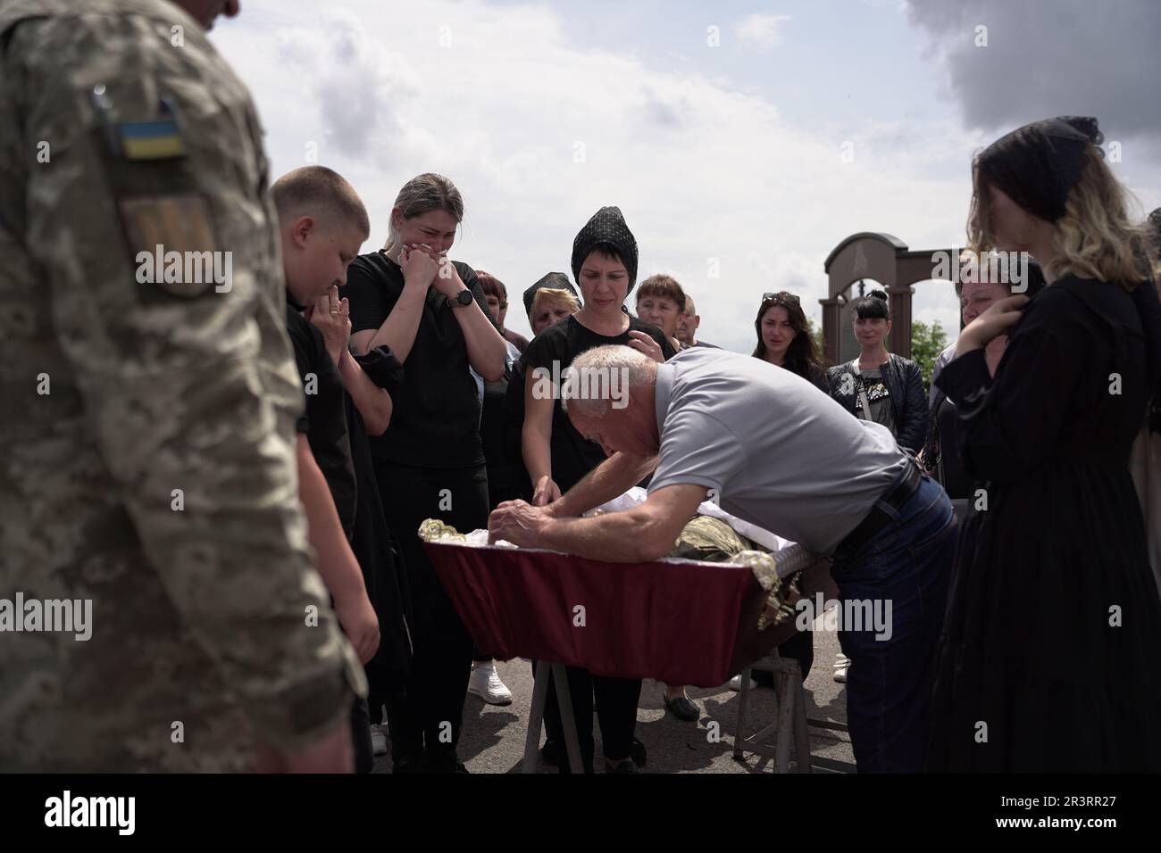 https://c8.alamy.com/comp/2R3RR27/dnipro-ukraine-24th-may-2023-editors-note-image-depicts-death-a-father-says-goodbye-to-his-dead-son-as-his-casket-is-ready-to-be-sealed-an-orthodox-military-funeral-was-held-in-a-dnipro-cemetery-for-47-year-old-ukrainian-serviceman-oleksandr-the-92nd-brigade-soldier-who-was-killed-by-a-russian-sniper-three-days-earlier-on-the-21st-of-may-in-novoselivka-kharkiv-oblast-photo-by-mihir-melwanisopa-imagessipa-usa-credit-sipa-usaalamy-live-news-2R3RR27.jpg
