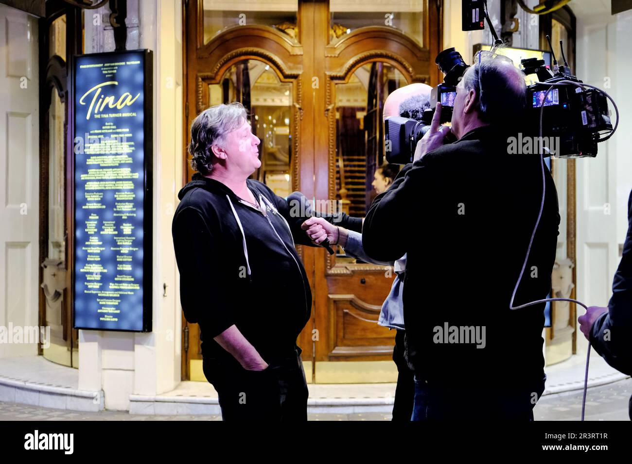 London, UK. 24th May, 2023. A Tina Turner fan, reportedly a former dancer for the star, is interviewed by a camera crew  outside the Aldwych Theatre where a production of Tina: The Tina Turner Musical has been showing since 2018. It was announced by her publicist, that the charismatic Tennessee born 'Queen of Rock 'n' Roll', died peacefully this evening at the age of 83 after a long illness. Credit: Eleventh Hour Photography/Alamy Live News Stock Photo