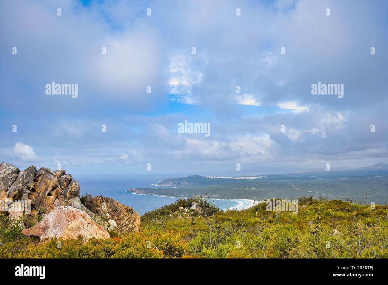 Panoramic view along the coast of Fitzgerald River National Park, Western Australia, from Mount Barren. Beautiful clouds, sweeping bay and long road Stock Photo