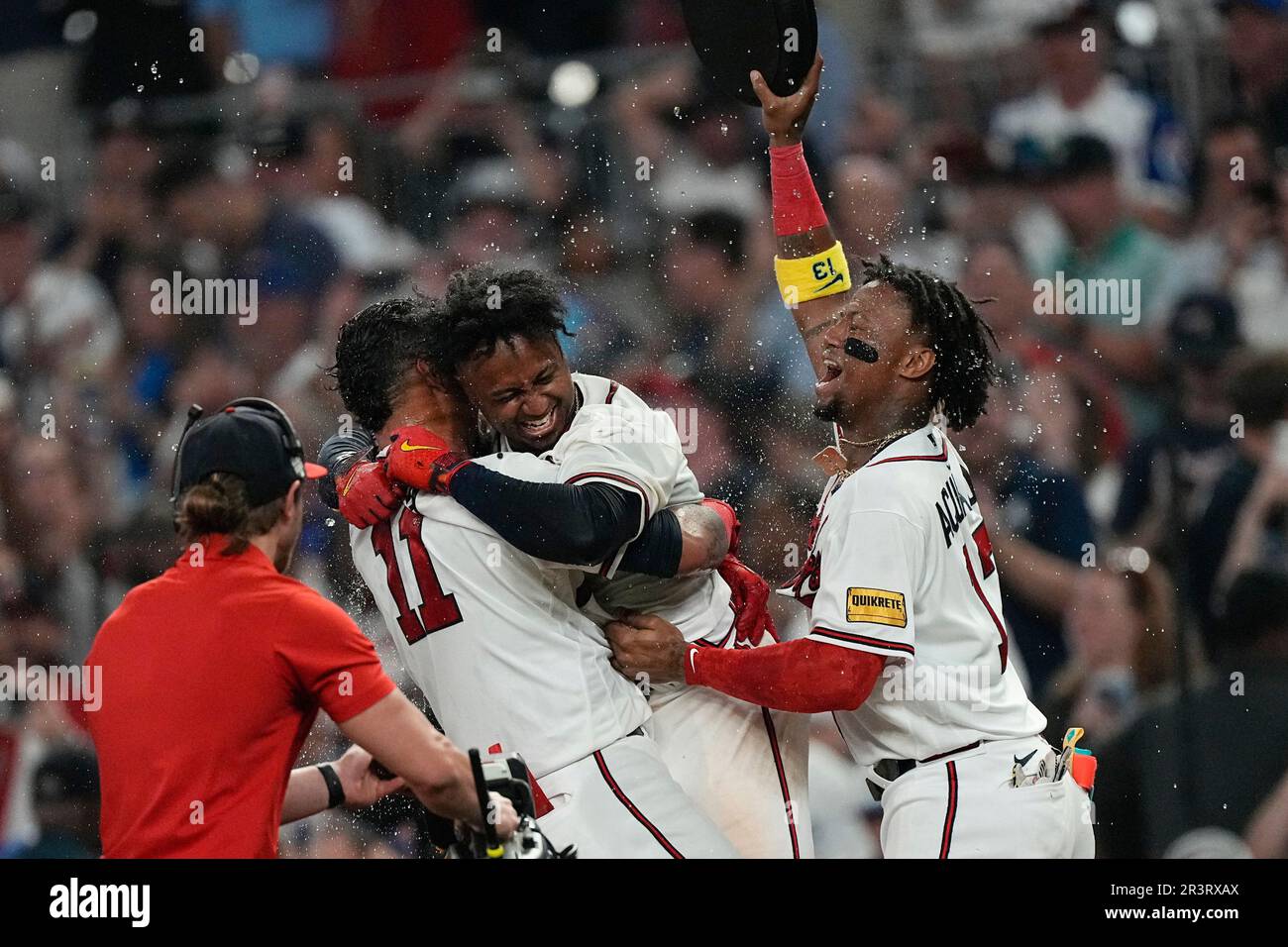 Atlanta Braves' Ozzie Albies (1) gets a hug from Orlando Arcia after hitting  a two-run home run in the fourth inning of a baseball game against the  Cincinnati Reds Tuesday, April 11