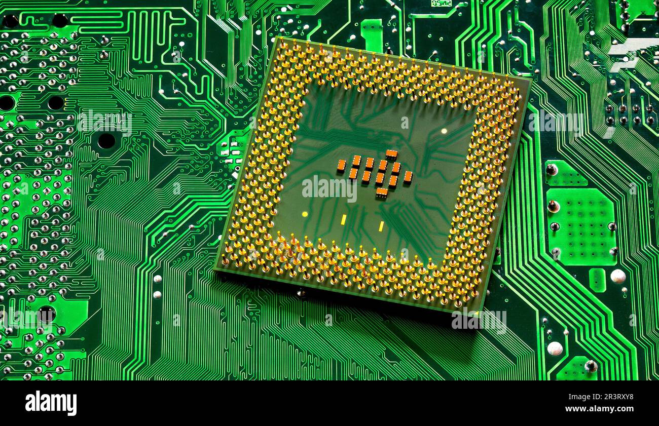 Close up of microchips and pins on Main CPU PC processor circuit Stock Photo