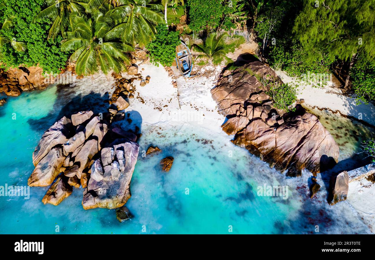 Drone view from above at a tropical beach in the Seychelles, Anse Volbert beach Praslin Stock Photo