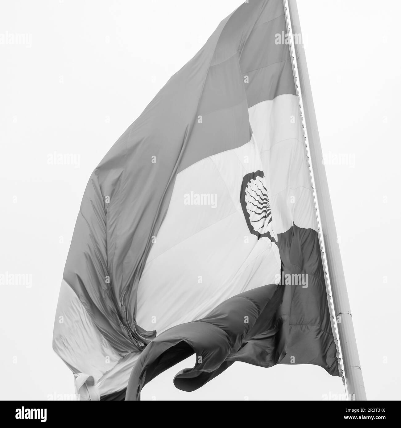 India flag flying high at Connaught Place with pride in blue sky, India