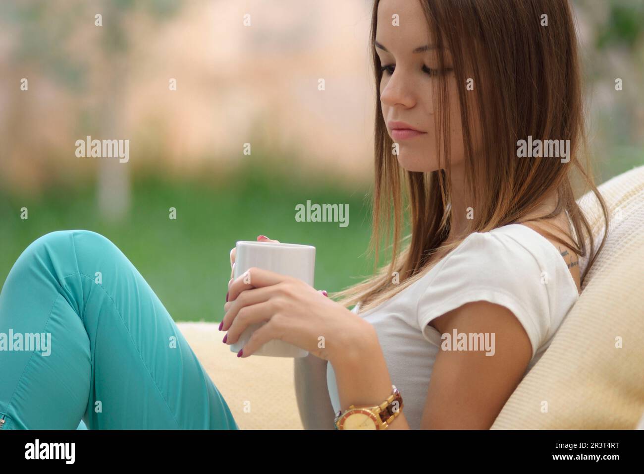 mujer joven bebiendo de una taza,islas baleares, Spain. Stock Photo