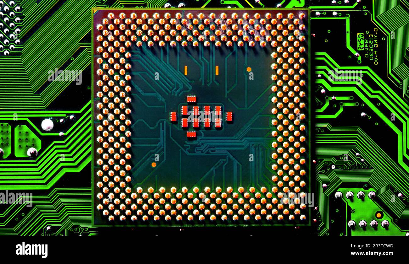 Close up of microchips and pins on Main CPU PC processor circuit Stock Photo