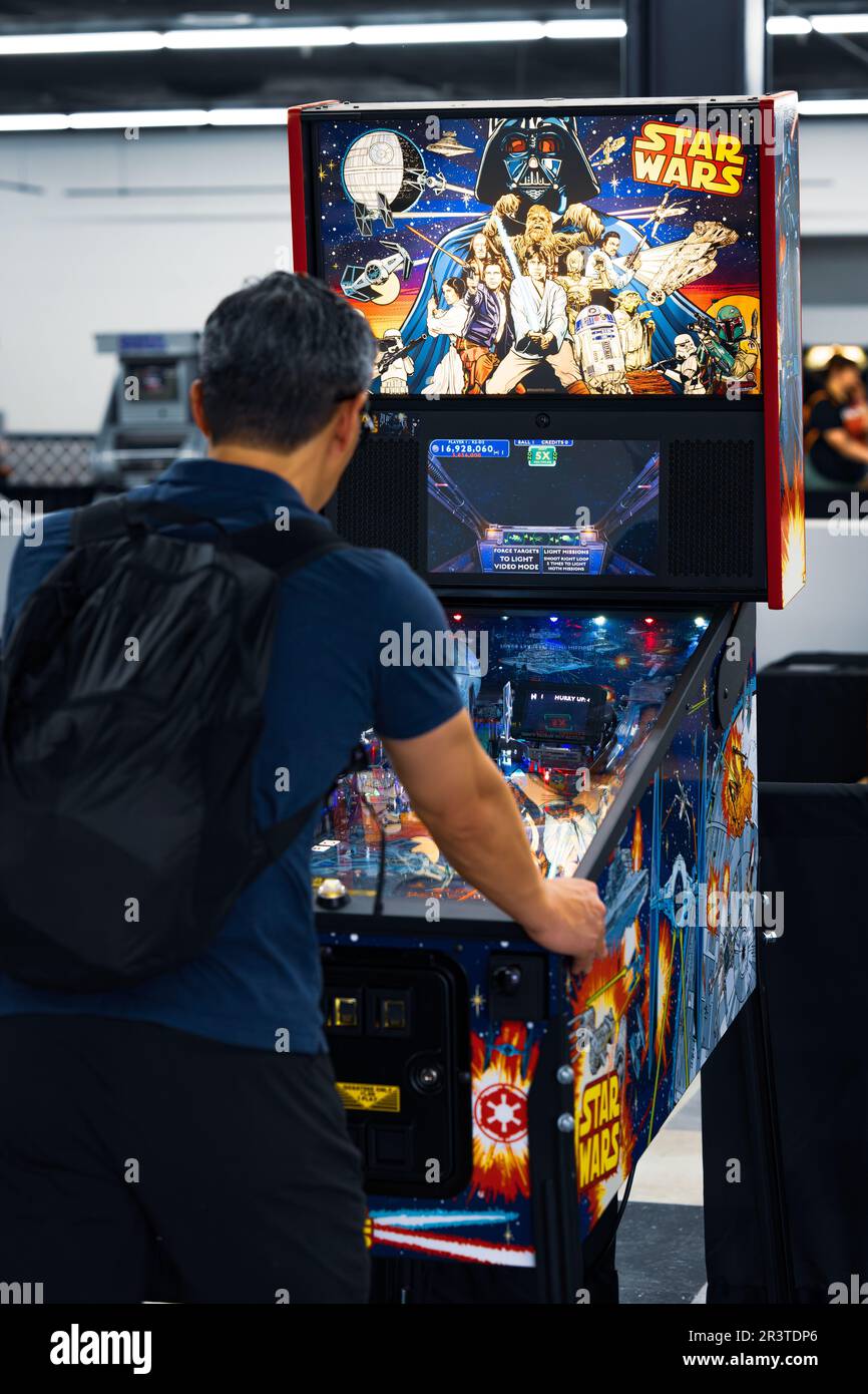 Man play Star Wars pinball machine at the Los Angeles County Fair May