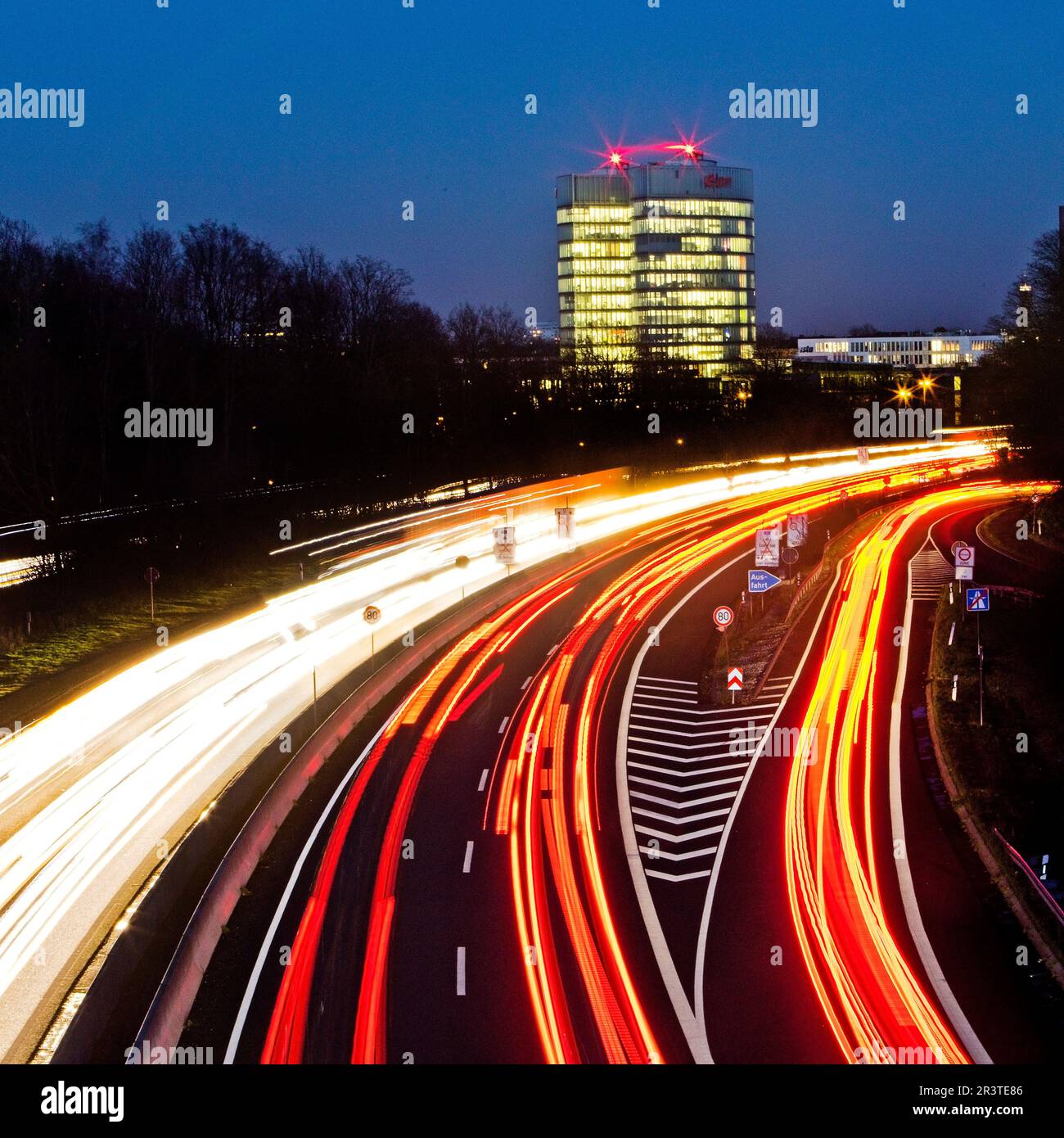 Highway A 52 and the E.ON SE corporate headquarters in the evening, Essen, Germany, Europe Stock Photo