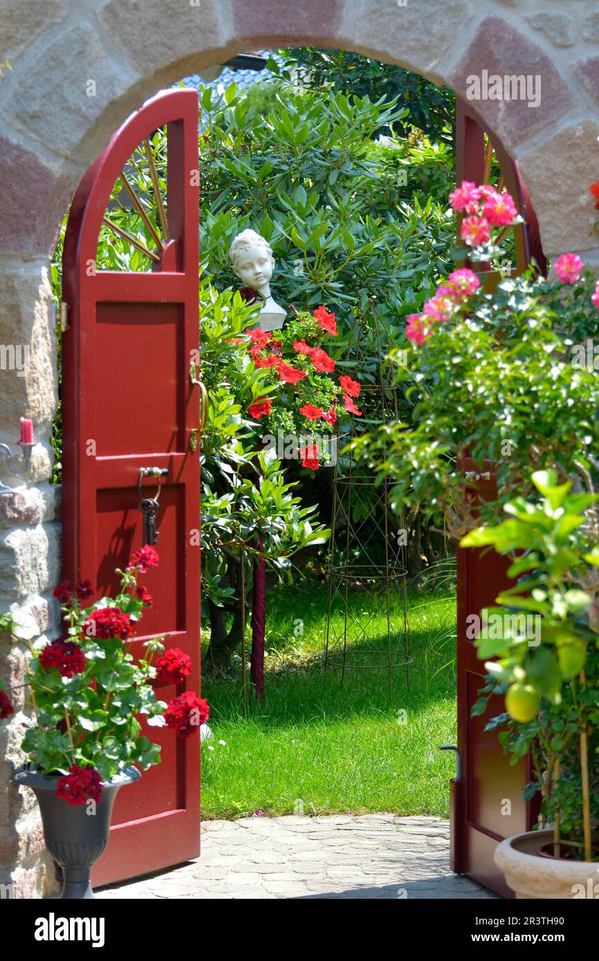 Natural stone, round arch in the garden, beautiful garden in summer, ornamental garden Stock Photo