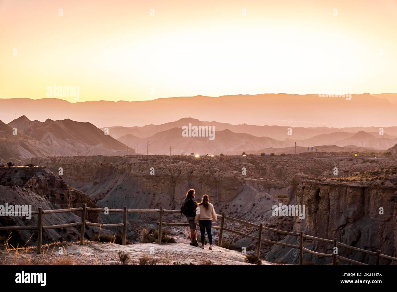 Couple watching the Tabernas Desert (Spanish: Desierto de Tabernas) is one of Spain's semi-arid deserts, located within Spain's south-eastern Stock Photo