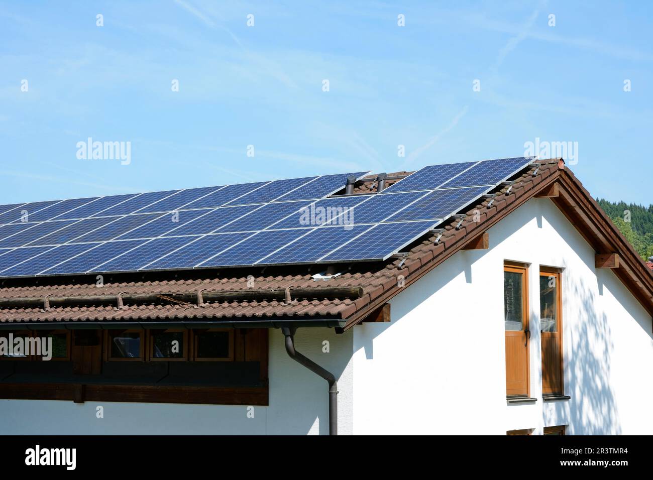 Energy creation with photovoltaic installation on the house roof Stock Photo