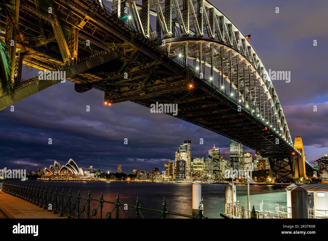 Harbour Bridge and Sydney Skyline at night, Milsons Point Wharf, Sydney, Australia Stock Photo
