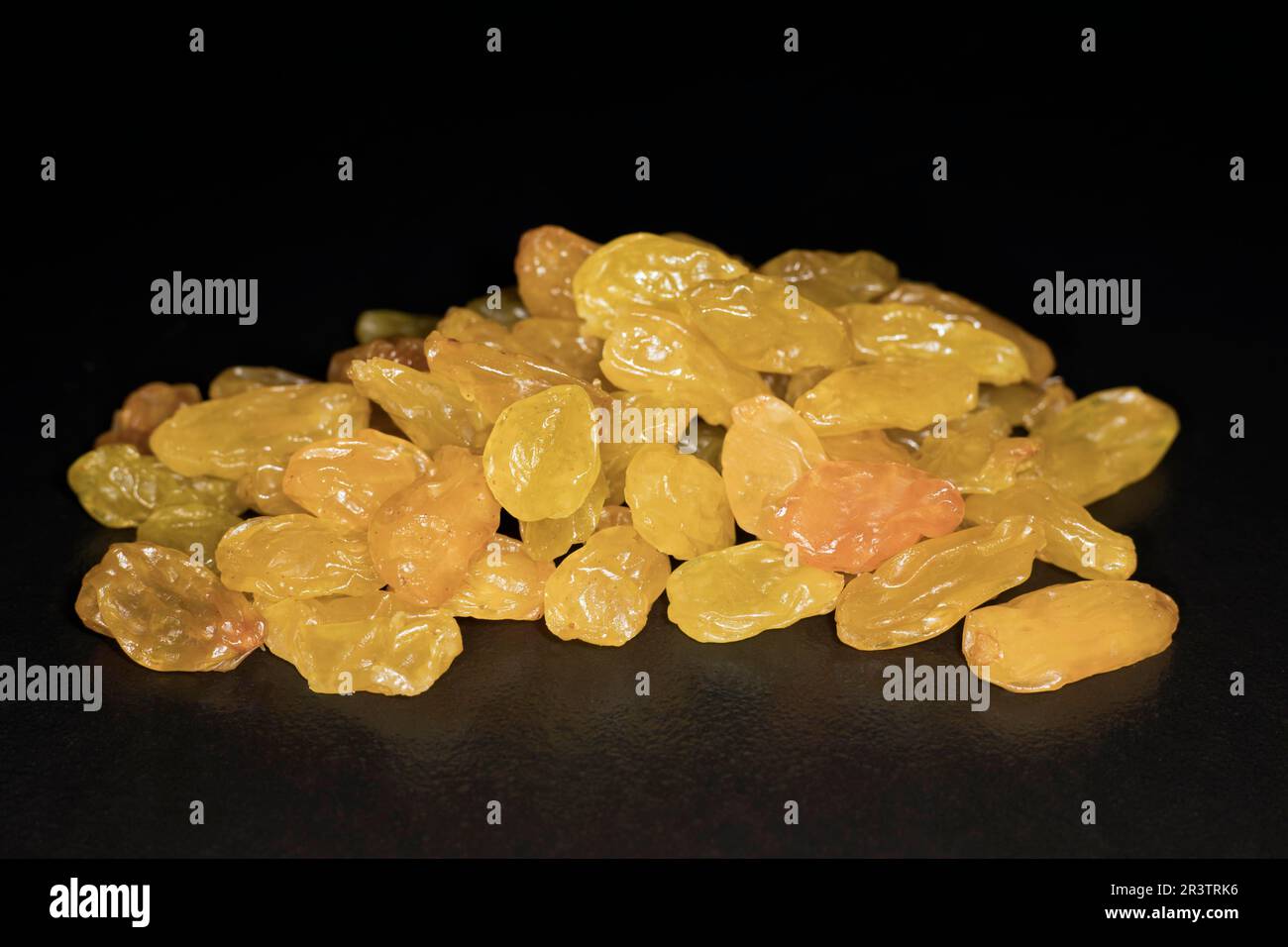 Sultanas, food photography with black background Stock Photo