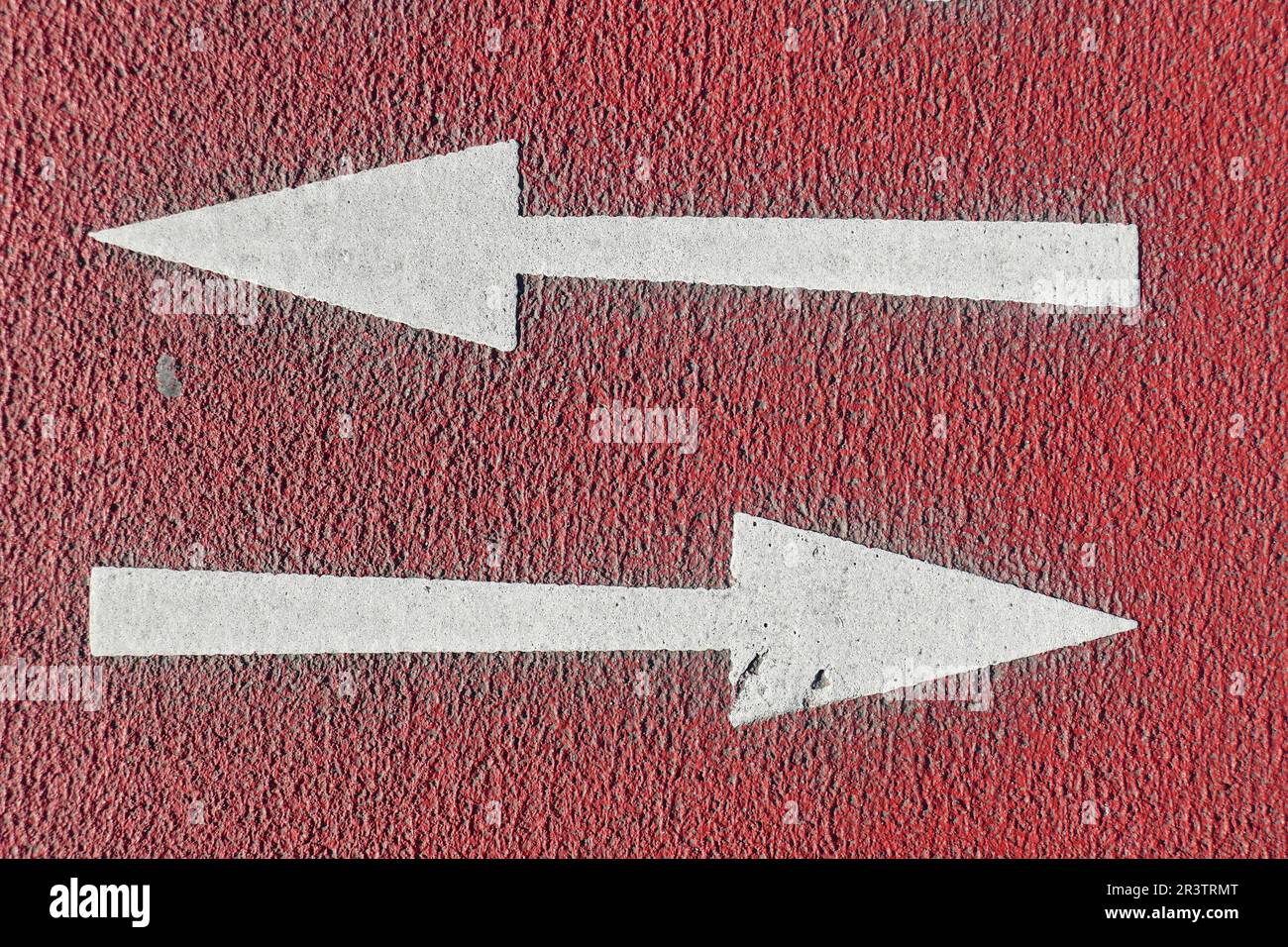 Ground marking directional arrows on a cycle path, Germany Stock Photo