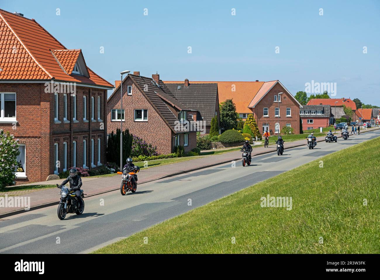 Motorcyclists riding through Hoopte, Winsen (Luhe), Lower Saxony, Germany Stock Photo