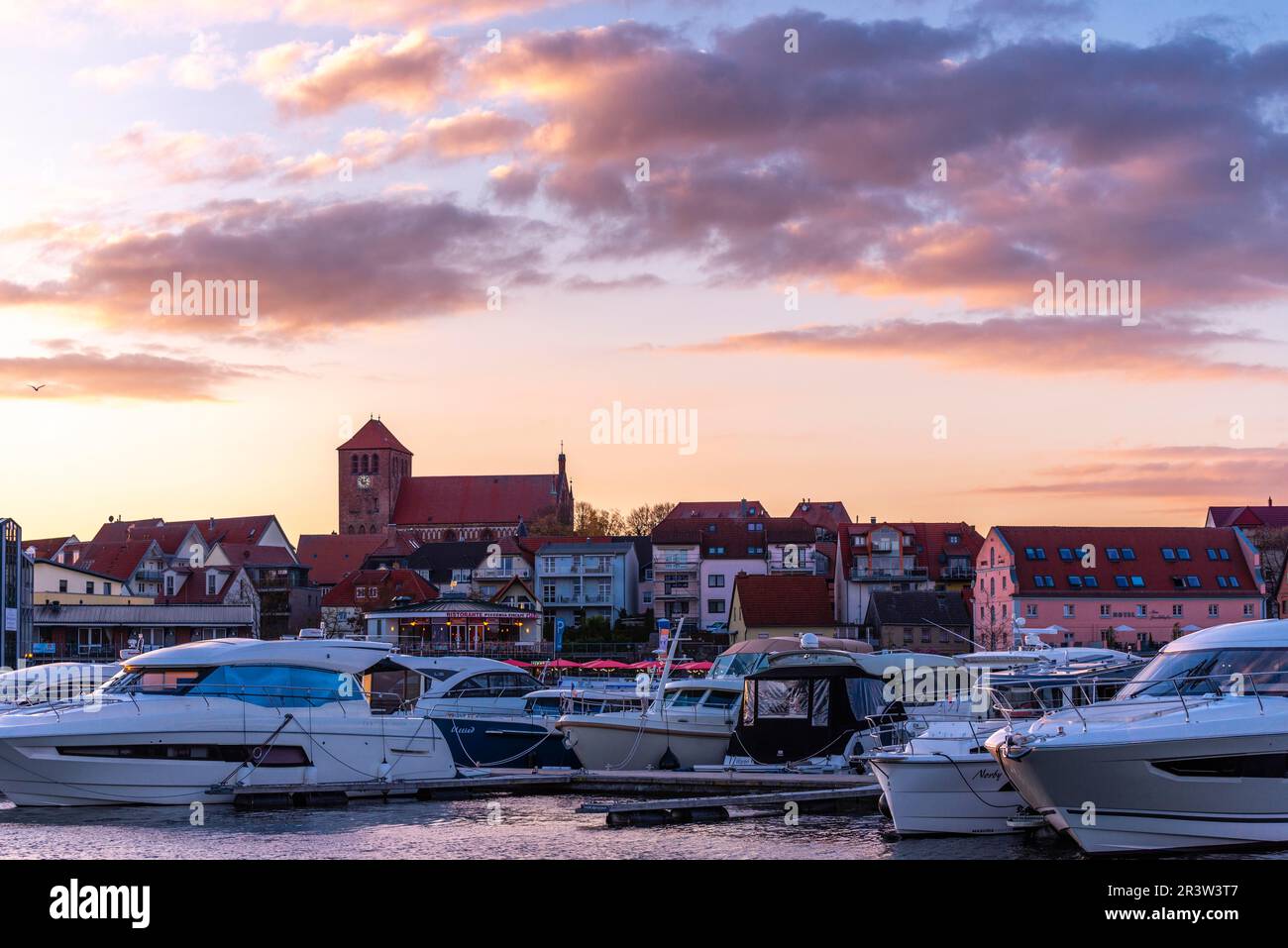 City harbour with motor boats, Waren, St. George's Church, evening light, sky, old town, Mecklemburg Lake District, Mecklenburg-Western Pomerania Stock Photo