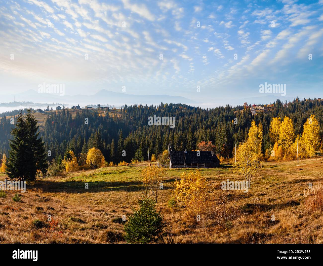 Morning slopes of the Carpathian Mountains (Yablunytsia village, Ivano-Frankivsk oblast, Ukraine). Autumn rural landscape. Stock Photo