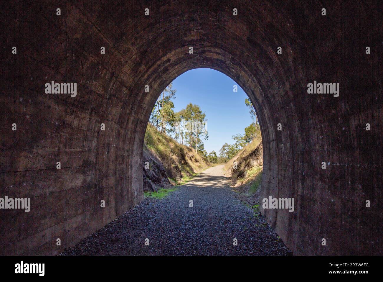 Yimbun Railway Tunnel, built from 1909 to 1910, is a concrete lined 100m straight tunnel in Harlin, Somerset Region, Queensland, Australia. Stock Photo