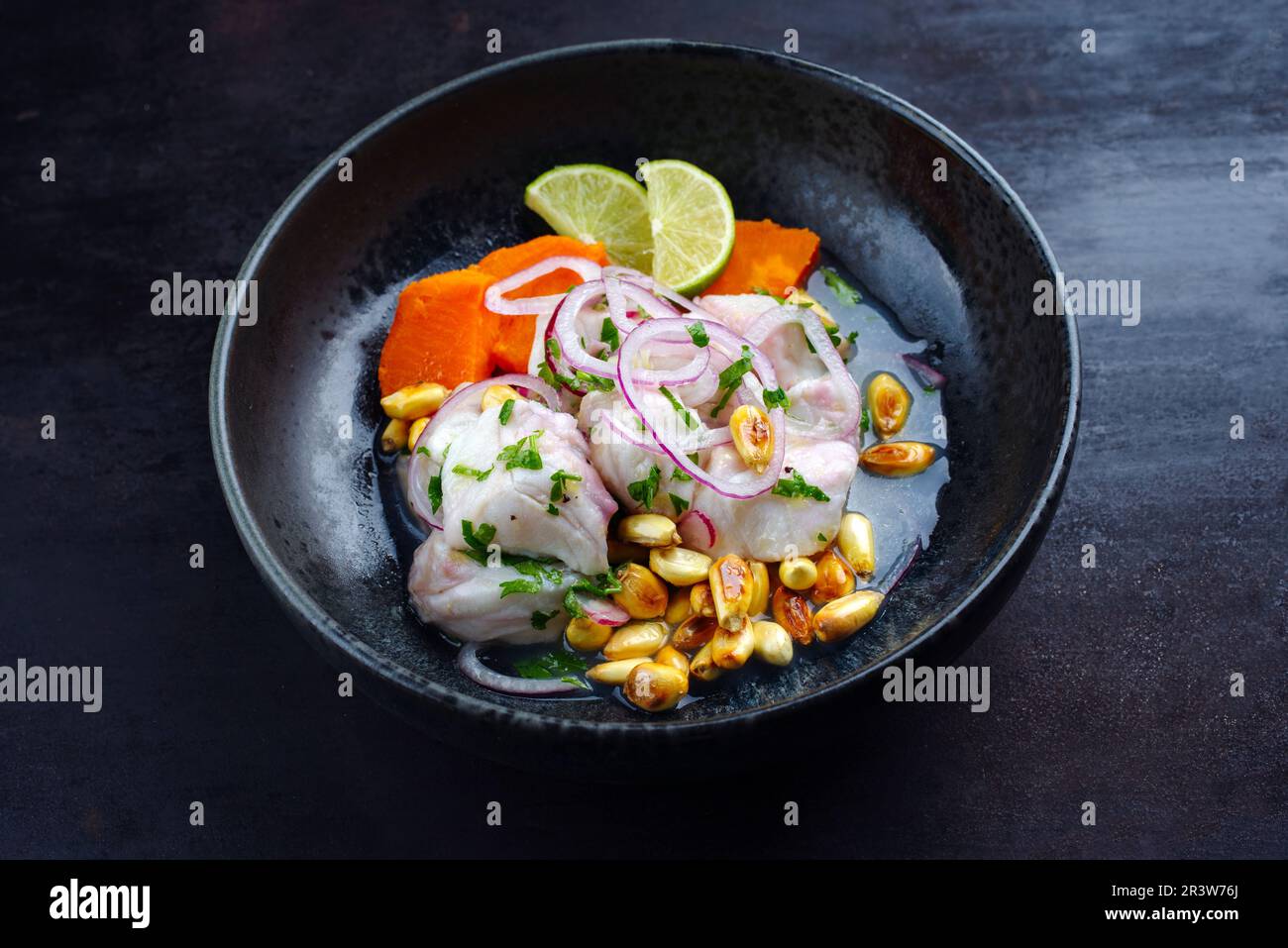 Traditional Peruvian gourmet ceviche sea bass filet piece with sweet