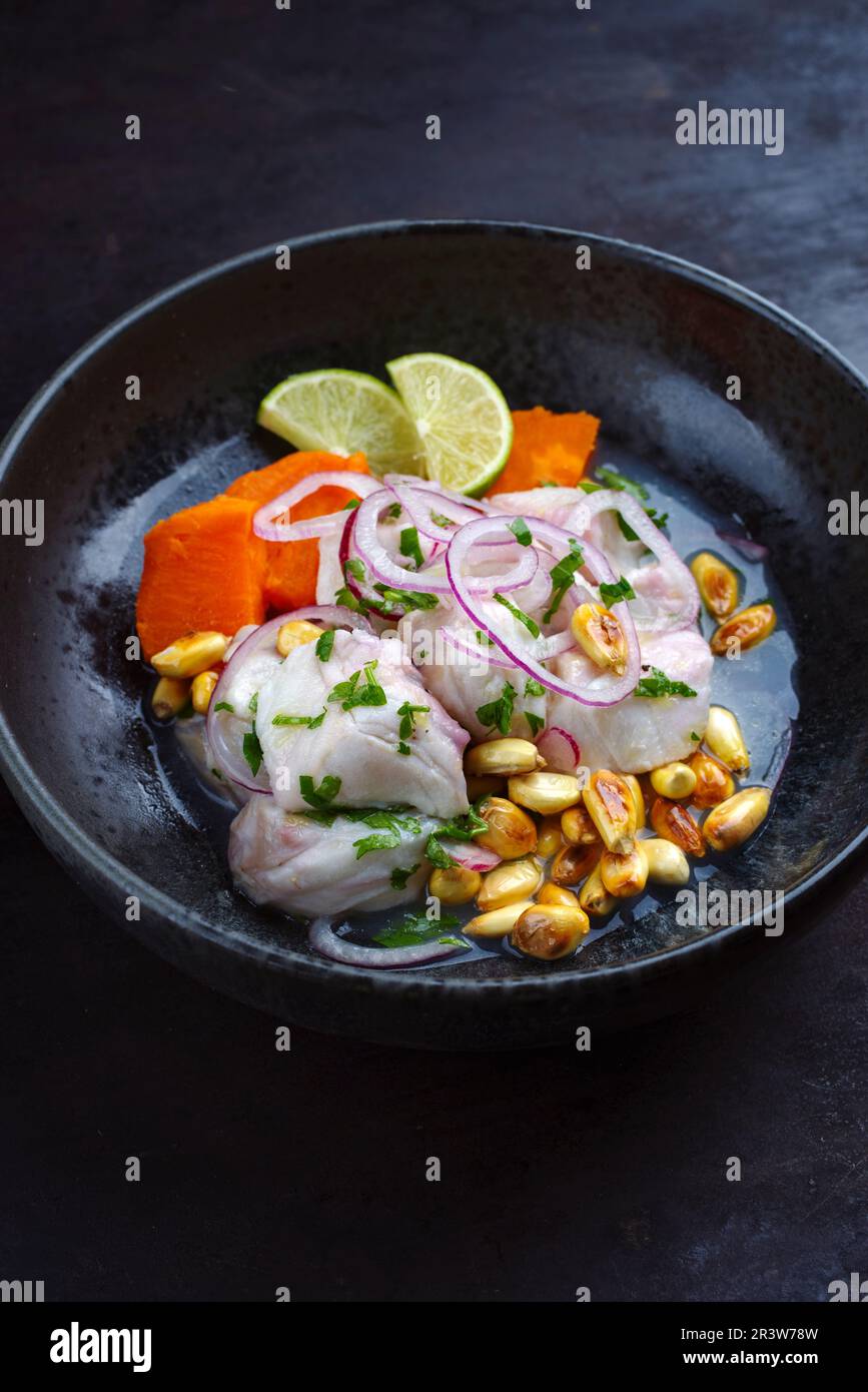 Peruvian ceviche with lime marinade, sweet potato, and cancha.