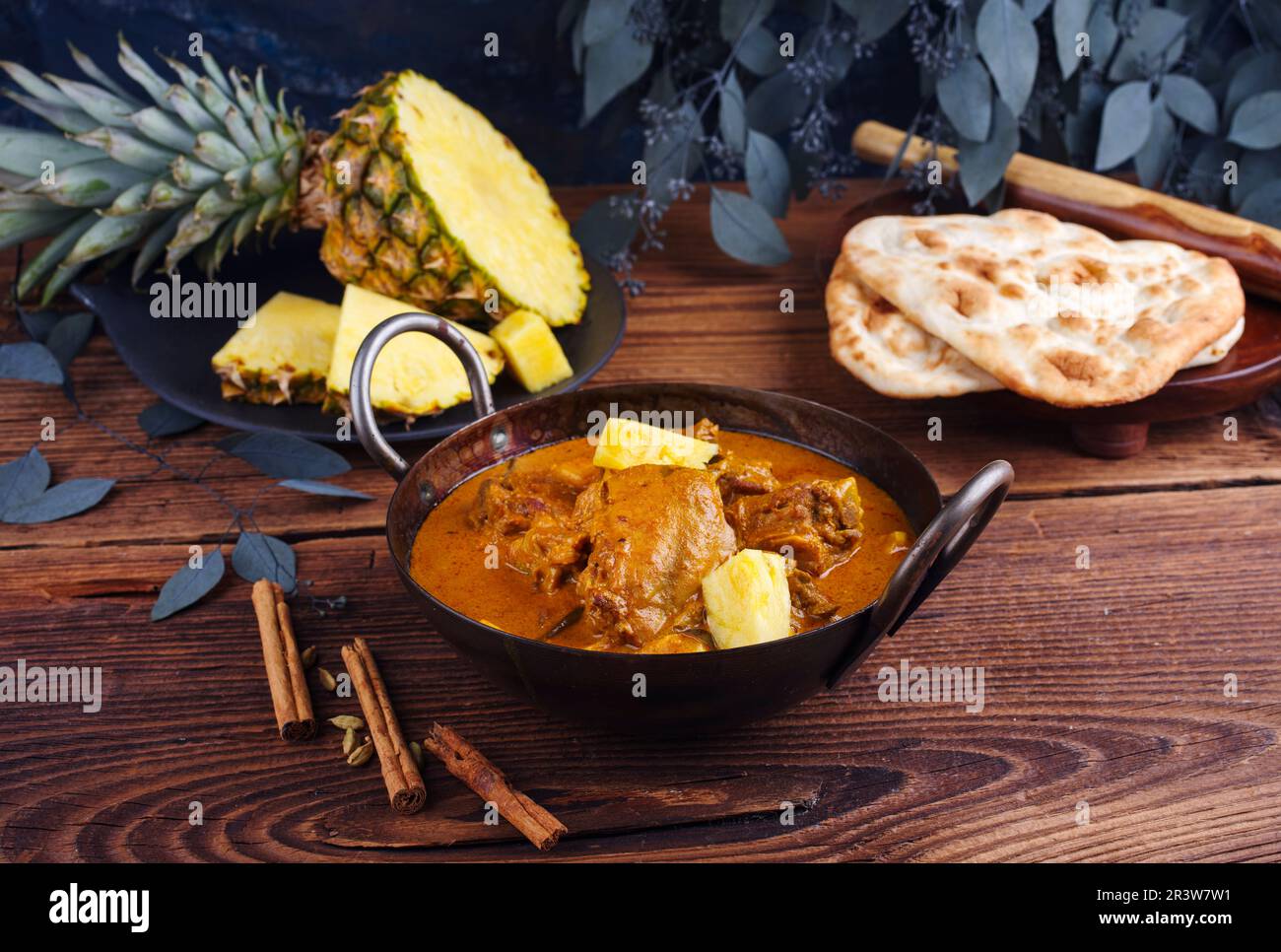 Traditional spicy Indian chicken Madras curry Rogan Josh with drumsticks Stock Photo