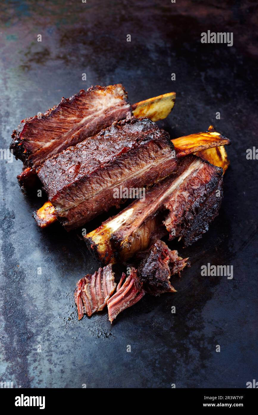Traditional barbecue burnt chuck short beef ribs marinated with spicy