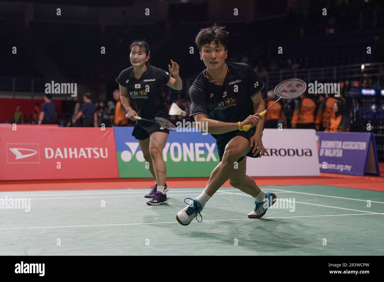South Koreas Kim Won Ho, front, and Jeong Na Eun play during their mixed doubles badminton match against Japans Kyohei Yamashita and Naru Shinoya at the Malaysia Masters badminton tournament in Kuala