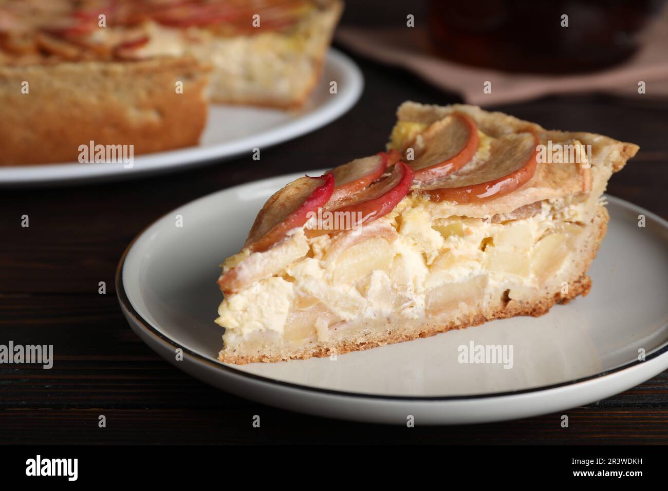 Piece of delicious homemade apple pie on wooden table, closeup Stock Photo