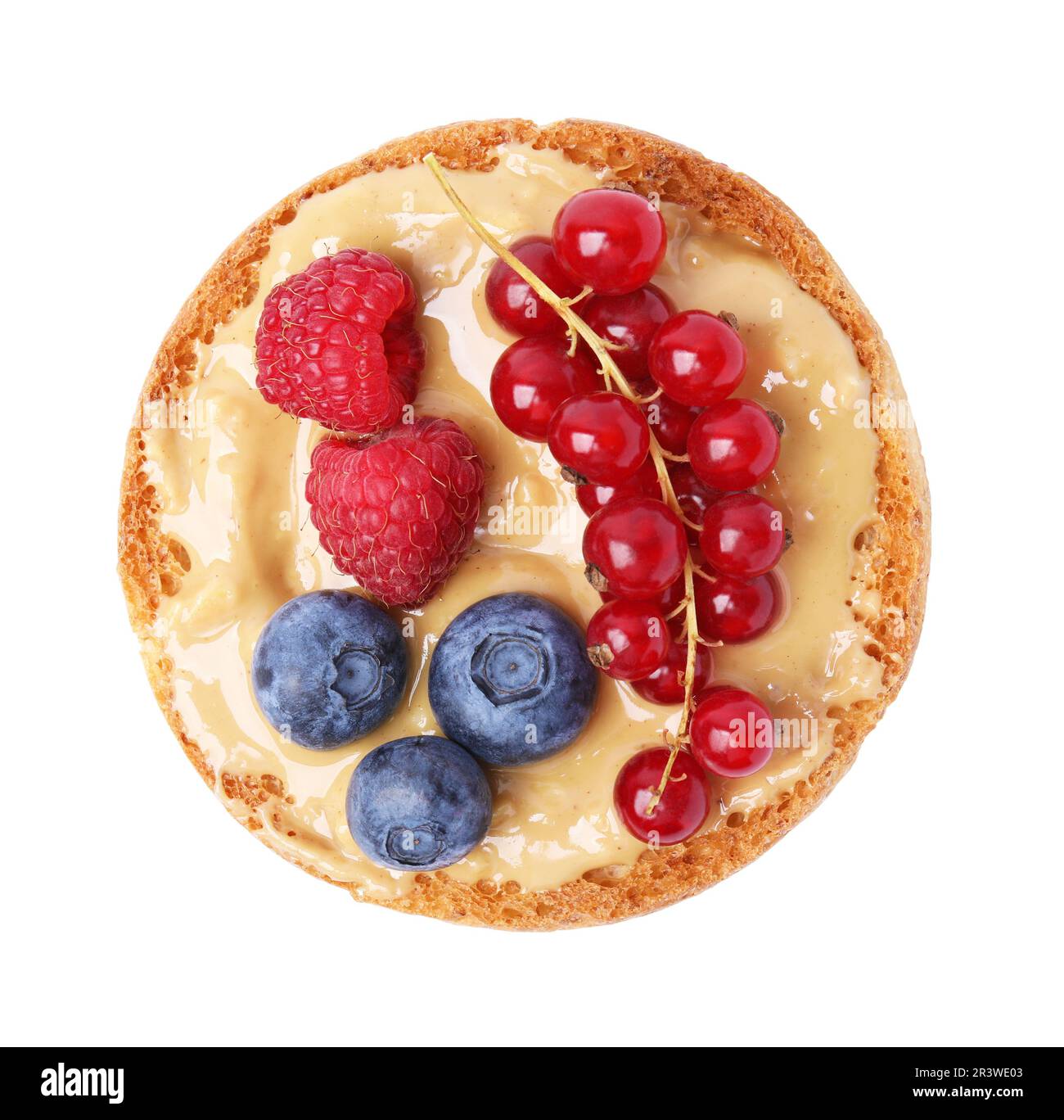 Tasty organic rusk with peanut butter and sweet berries isolated on ...