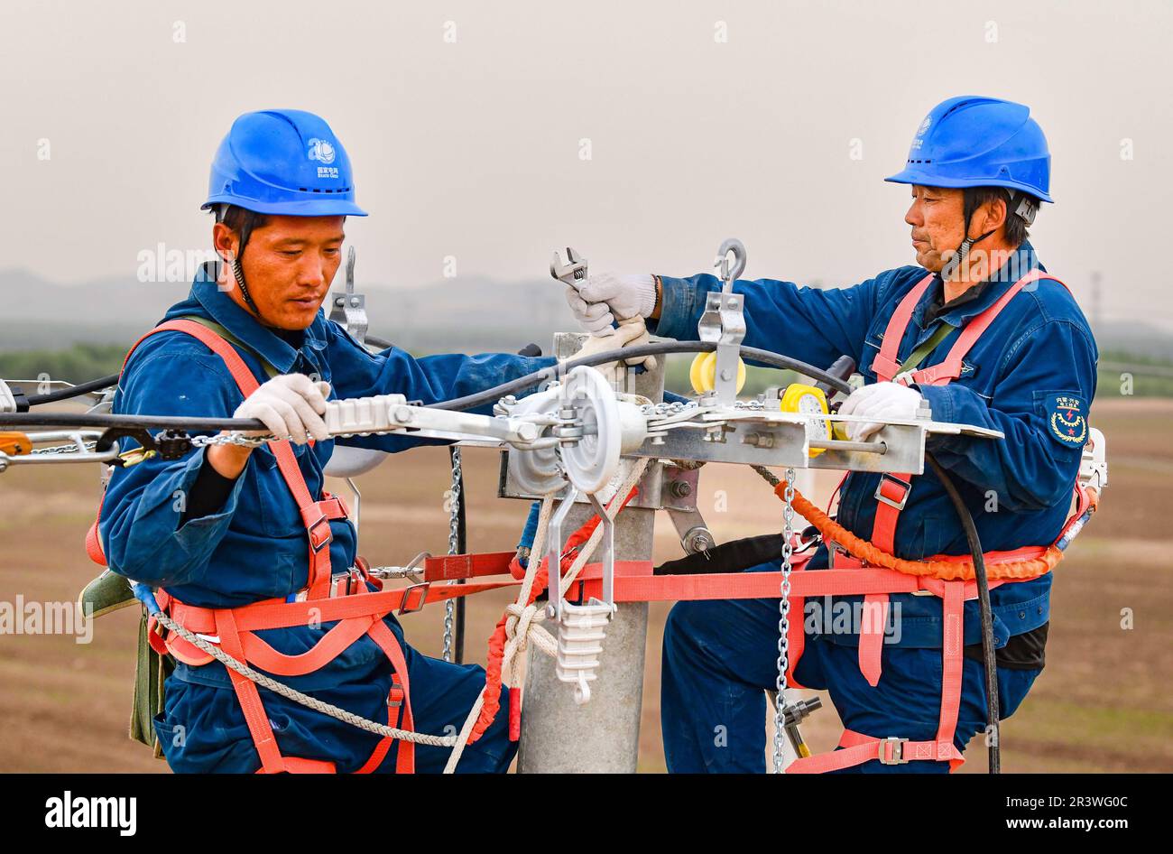 HINGGAN LEAGUE, CHINA MAY 25, 2023 Workers of a power supply