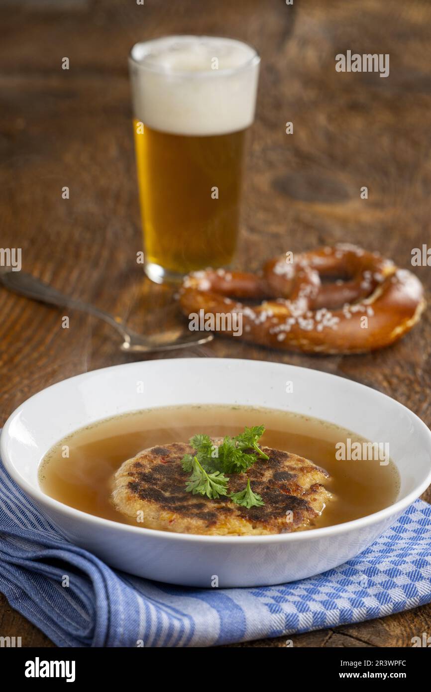 Austrian cheese dumpling soup on wood Stock Photo