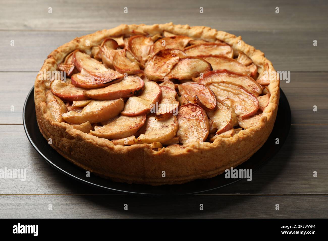 Fresh delicious apple pie on wooden table Stock Photo