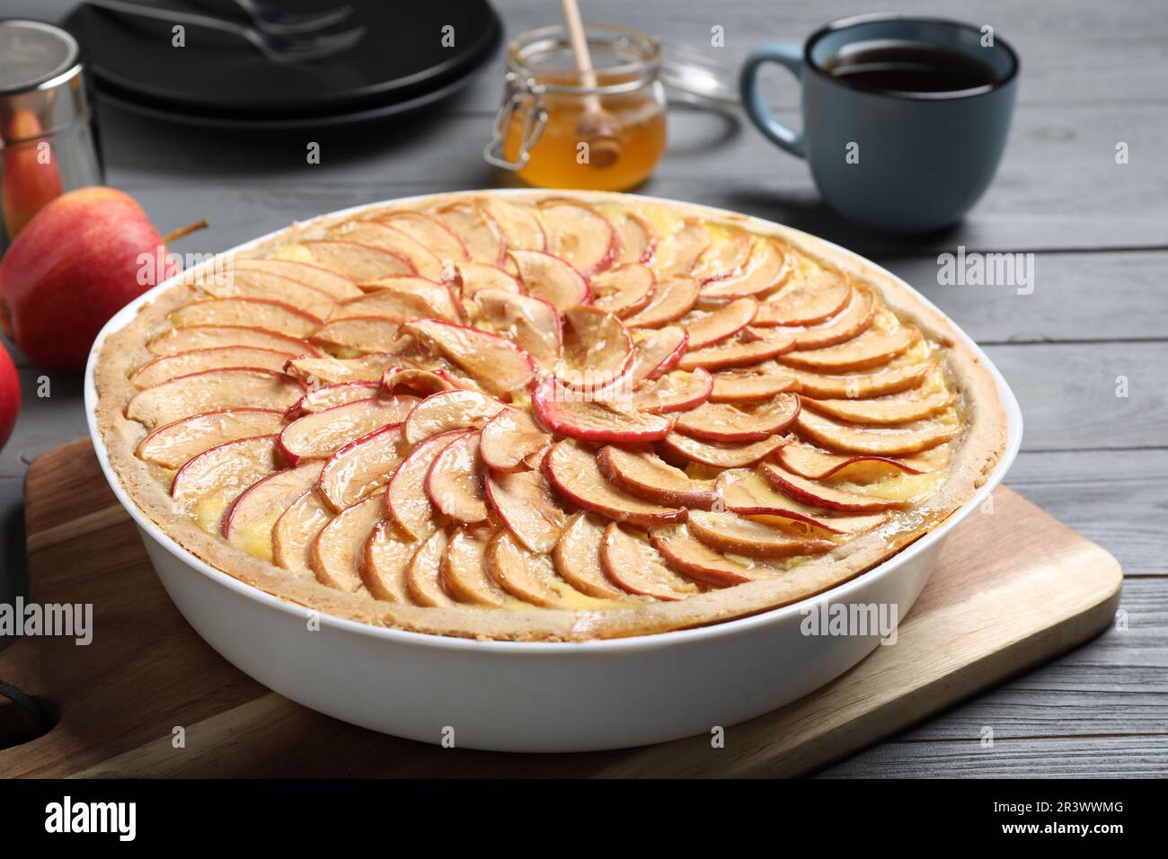Tasty apple pie on grey wooden table Stock Photo
