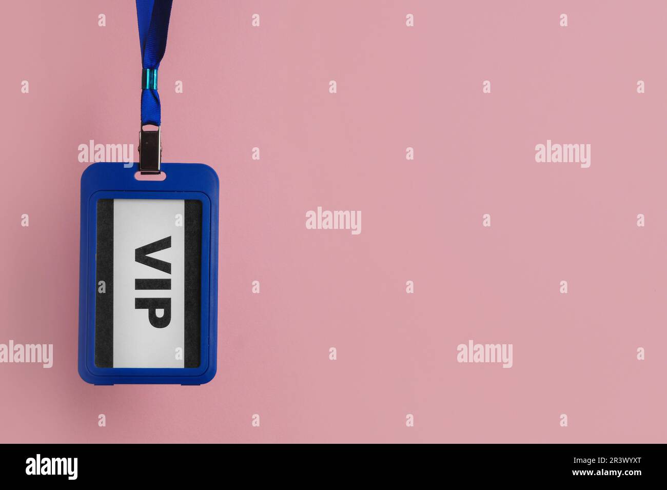 Plastic vip badge hanging on pale pink background, space for text Stock ...