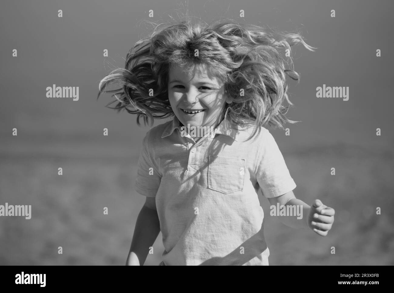 Emotional portrait of a child in the playground. Outdoor kids activity. Stock Photo